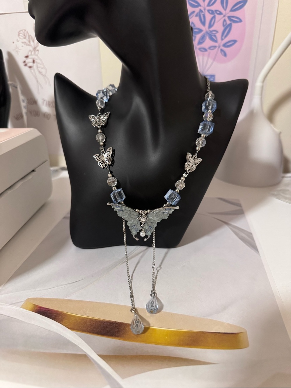 Silver Butterfly Pendant Necklace with Light Blue Beads